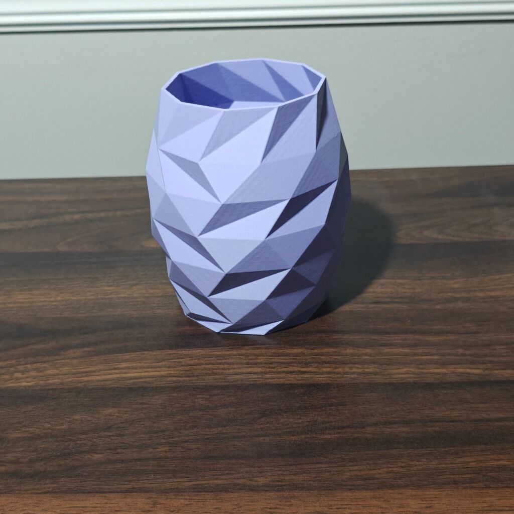 Low-poly geometric 3D printed vase in blue-purple gradient